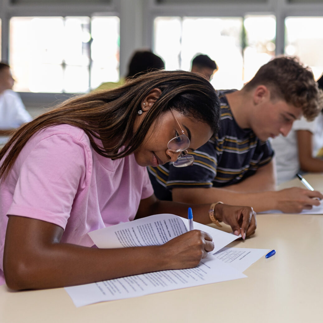 High school students in class, taking a test.